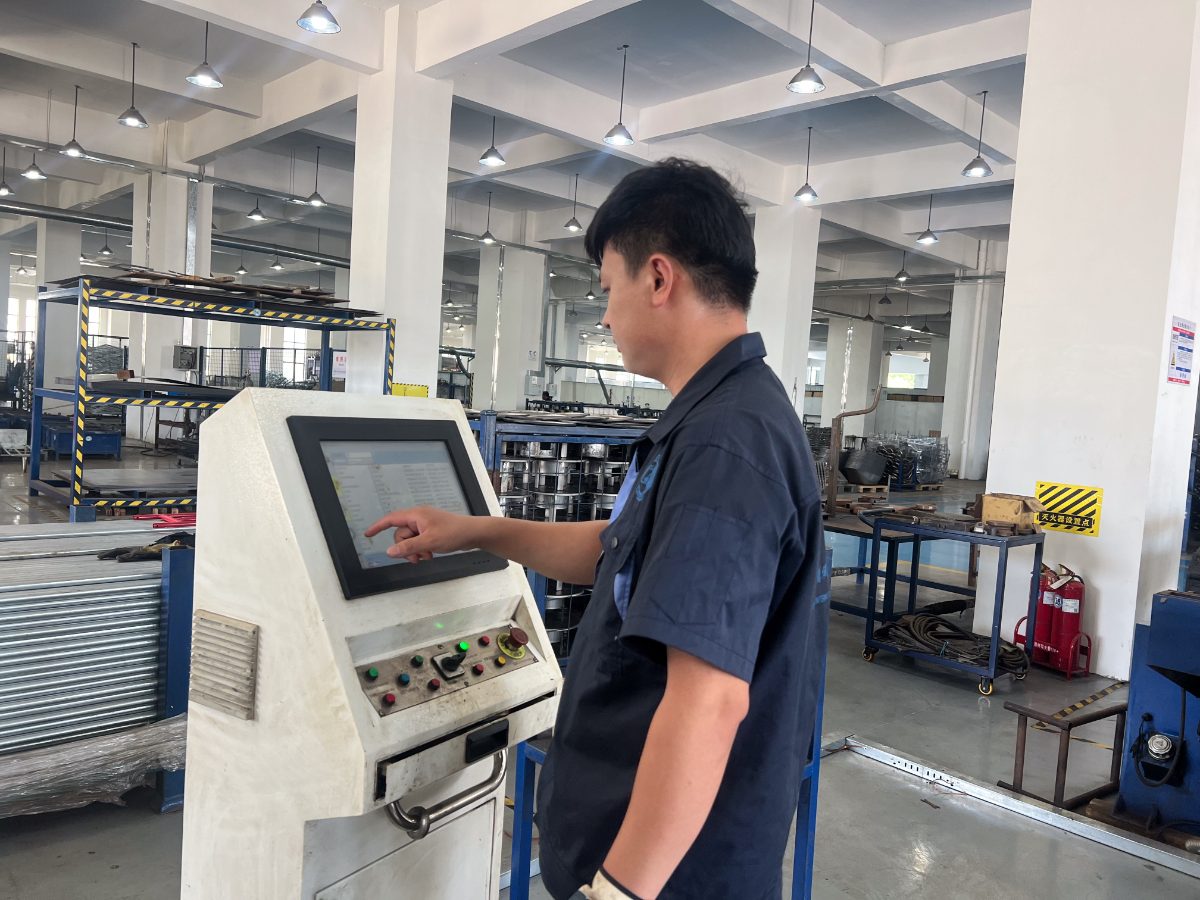 Operator at machine control panel